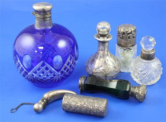 Seven assorted Victorian and later silver mounted glass scent/salts bottles including Sampson Mordan & Co, largest 4.75in.